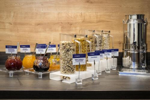 a display of different types of food in glass jars at Holiday Inn Express Baden-Baden by IHG in Baden-Baden