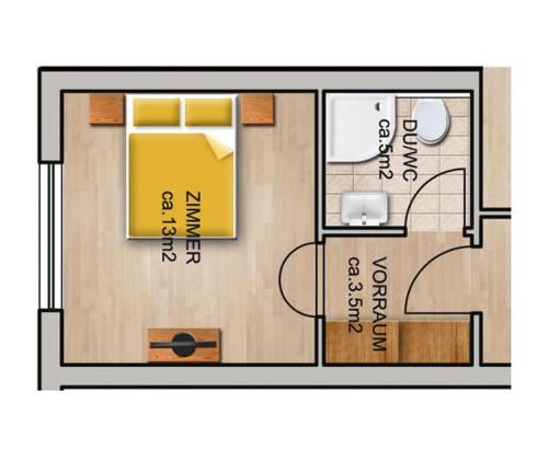 a floor plan of a small house with yellow at Sportpension Elisabeth in Neustift im Stubaital
