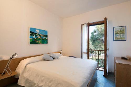 Postel nebo postele na pokoji v ubytování Punta Marana - Your House in Sardinia