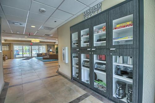 an office lobby with a refrigerator in the wall at Candlewood Suites Columbus - Grove City by IHG in Grove City