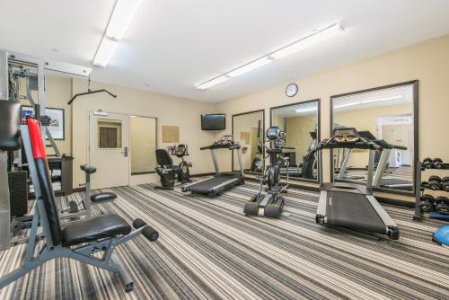 a fitness room with treadmills and elliptical machines at Candlewood Suites Atlanta West I-20 by IHG in Lithia Springs
