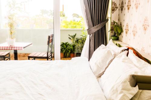 Postel nebo postele na pokoji v ubytování Memory Homestay Hue
