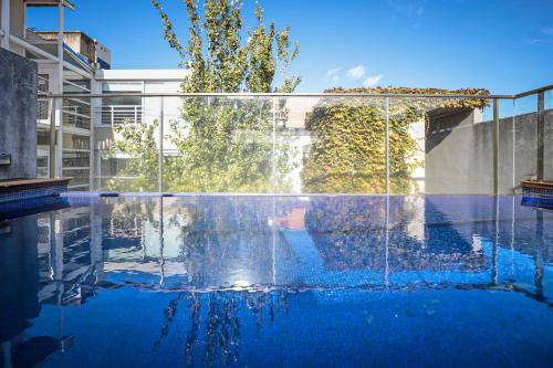 a swimming pool with a fountain in a building at Boutique Design Studio in Palermo Soho in Buenos Aires