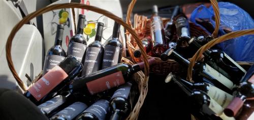 a basket filled with lots of bottles of wine at Villa Gelati in Kutaisi