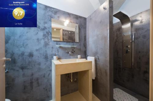 a bathroom with a sink and a mirror at Le Volte in Sannicola