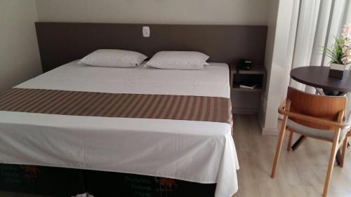 Postel nebo postele na pokoji v ubytování Palotina Palace Hotel