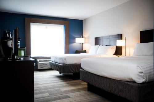 a hotel room with two beds and a window at Holiday Inn Express Dayton, an IHG Hotel in Dayton