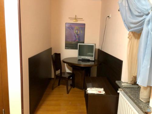 TV a/nebo společenská místnost v ubytování Arcadia