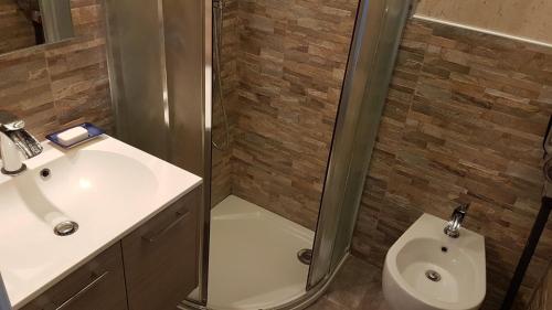 a bathroom with a shower and a sink and a toilet at Lovely apartment in Marina Baie des Anges- Baronnet - Sew view, free parking spaces on site, restaurants, beach, supermarket in Villeneuve-Loubet
