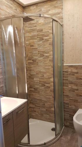 a shower in a bathroom with a toilet and a sink at Lovely apartment in Marina Baie des Anges- Baronnet - Sew view, free parking spaces on site, restaurants, beach, supermarket in Villeneuve-Loubet