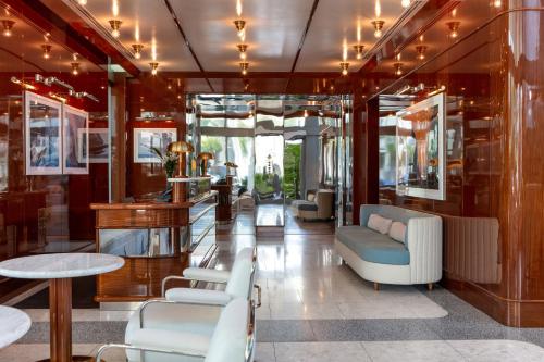 a lobby with couches and chairs and a table at Mr. C Miami - Coconut Grove in Miami