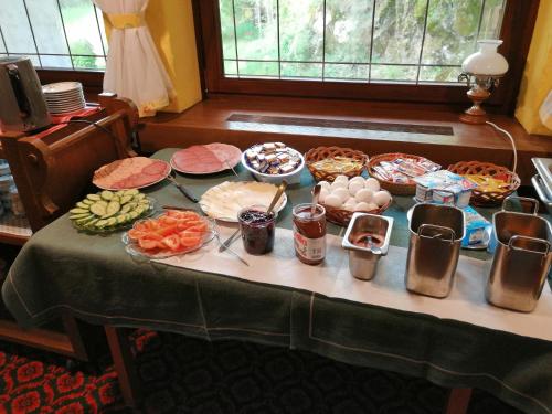 a table with a bunch of food on it at BE ME Black Forest Family Apartment -Zum Letzten G'Stehr in Bad Rippoldsau