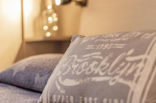 a pillow sitting on top of a bed at La Casa Rosa in Terni