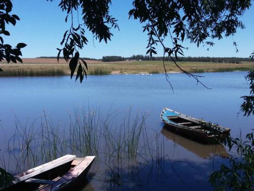 two boats are sitting on the water on a lake at Naturaleza pura in Rocha