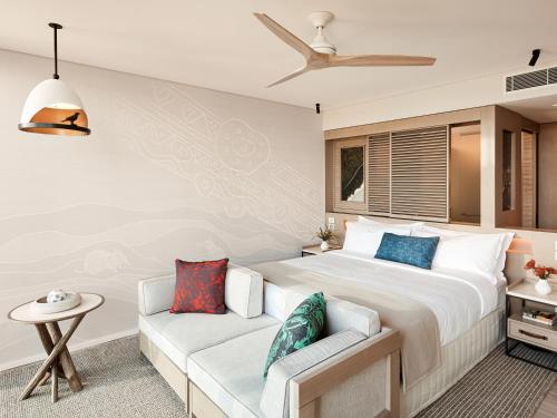 a bedroom with a large bed and a couch at Wildlife Retreat at Taronga in Sydney