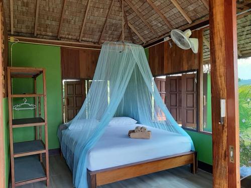 מיטה או מיטות בחדר ב-Kham Ecolodge