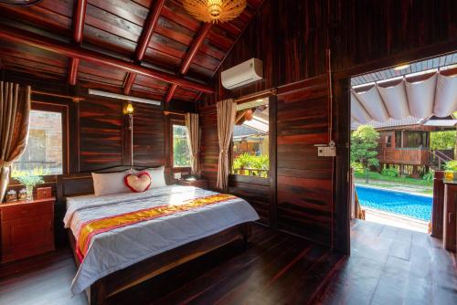 Giường trong phòng chung tại Anna Pham Bungalow