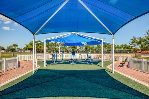 a blue canopy over a playground in a park at Ocean Place in Ocean City