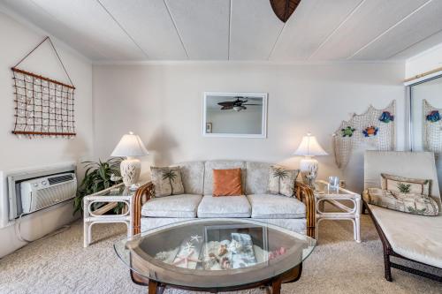 a living room with a couch and a table at Ocean Place in Ocean City