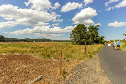 a group of people walking down a road at Quelah Condo 73 | Discover Sunriver in Sunriver