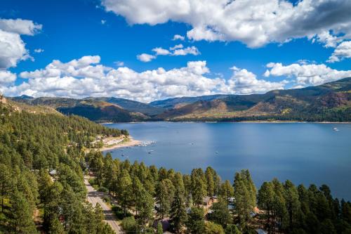 an aerial view of a lake in the mountains at The Better House in Vallecito