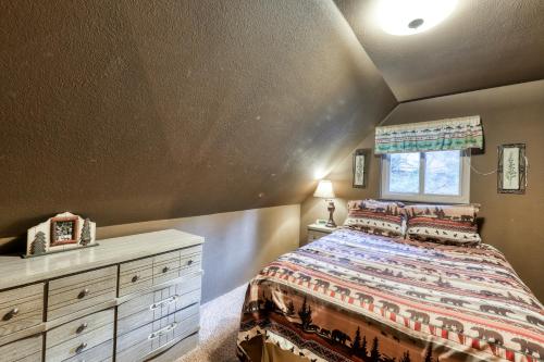 a bedroom with a bed and a dresser and a window at The Limit in Dora Belle