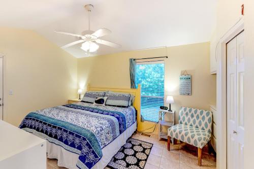 a bedroom with a bed and a ceiling fan at Long Island Village Unit 111 in Port Isabel