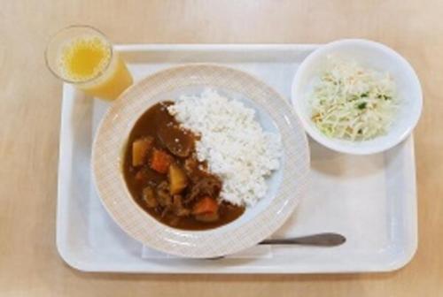 a tray with a bowl of soup and rice and a drink at Sun Hotel Tosu Saga in Tosu