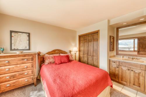 a bedroom with a bed and a sink at Beautiful Mountain View Condo in Crested Butte