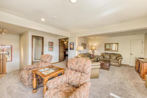 a living room with couches and a table at Beautiful Mountain View Condo in Crested Butte