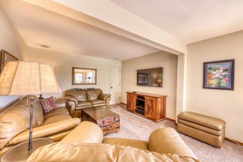 a living room with a couch and a table at Beautiful Mountain View Condo in Crested Butte