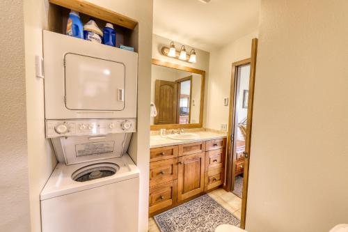 a small bathroom with a washer and dryer in it at Beautiful Mountain View Condo in Crested Butte