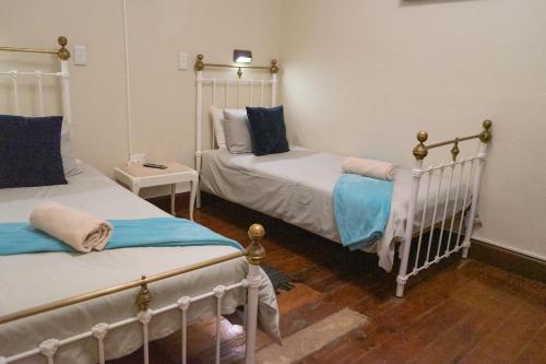 Ένα ή περισσότερα κρεβάτια σε δωμάτιο στο Bay Vista Guesthouse