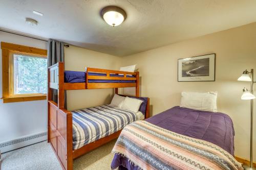a bedroom with two beds and a bunk bed at Ore House 8 in Frisco