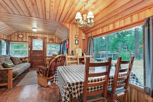 a dining room with a table and a couch at Cast Away in Manitowish Waters
