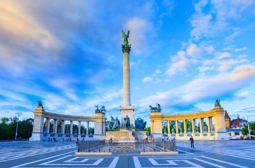 a large monument in front of a building at Park&Art Boutique Suites in Budapest