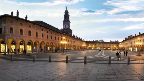 a large building with a clock tower in the distance at B&B dalLo Zio in Ottobiano