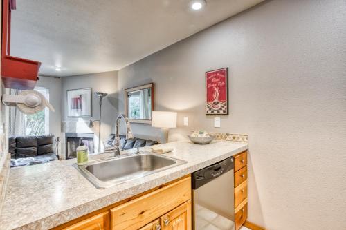 a kitchen with a sink and a counter at Beaches Inn | Pacific Surf Townhouse in Cannon Beach
