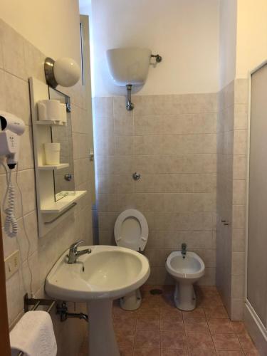 a bathroom with a sink and a toilet at Domus Santa Caterina in Rome