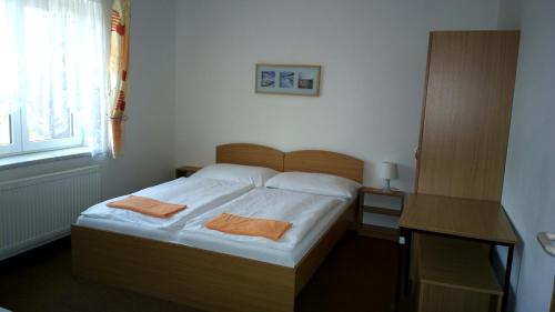 Posteľ alebo postele v izbe v ubytovaní Penzion Lada