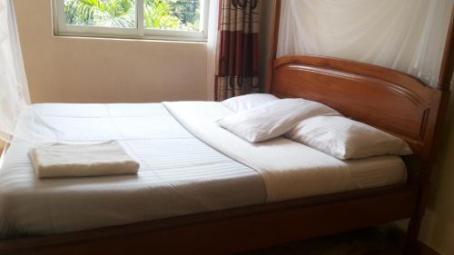 RoseVilla Hotelにあるベッド