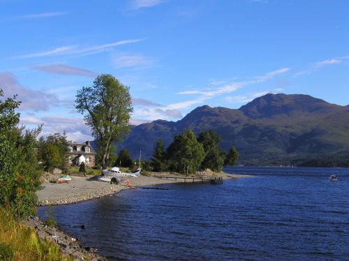 a view of a lake with mountains in the background at Culag Lochside Self Catering in Luss