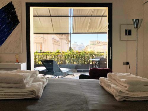 Postel nebo postele na pokoji v ubytování Casa Terrazza Colosseo