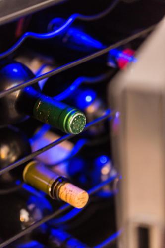 a bunch of wine bottles in a wine rack at Ocean Dream Apartment! in Balíon