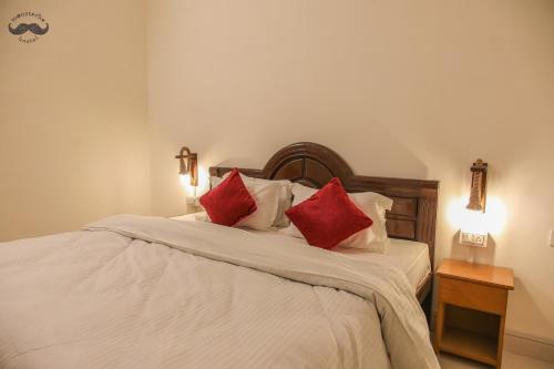 Una cama o camas en una habitación de Moustache Khajuraho
