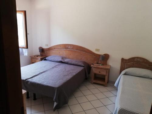Ένα ή περισσότερα κρεβάτια σε δωμάτιο στο Il Castagno