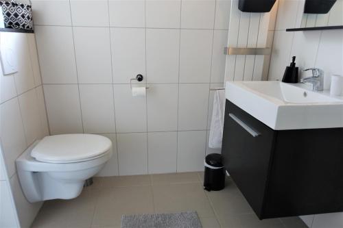 Kylpyhuone majoituspaikassa Vakantiehuis Merel