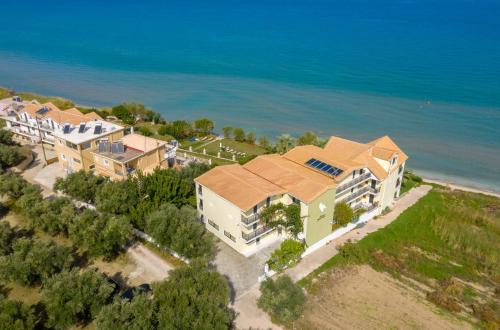 an aerial view of a house with the ocean behind it at Sea View Hotel in Alykes
