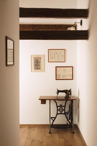 a table in the corner of a room with white walls at CHATA MISTRIK in Donovaly