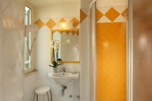 a bathroom with a sink and a mirror at Hotel Alessandrino in Rome